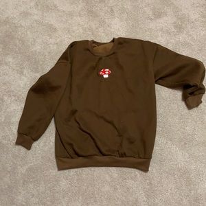 Brown amazon mushroom crew neck. Size medium.